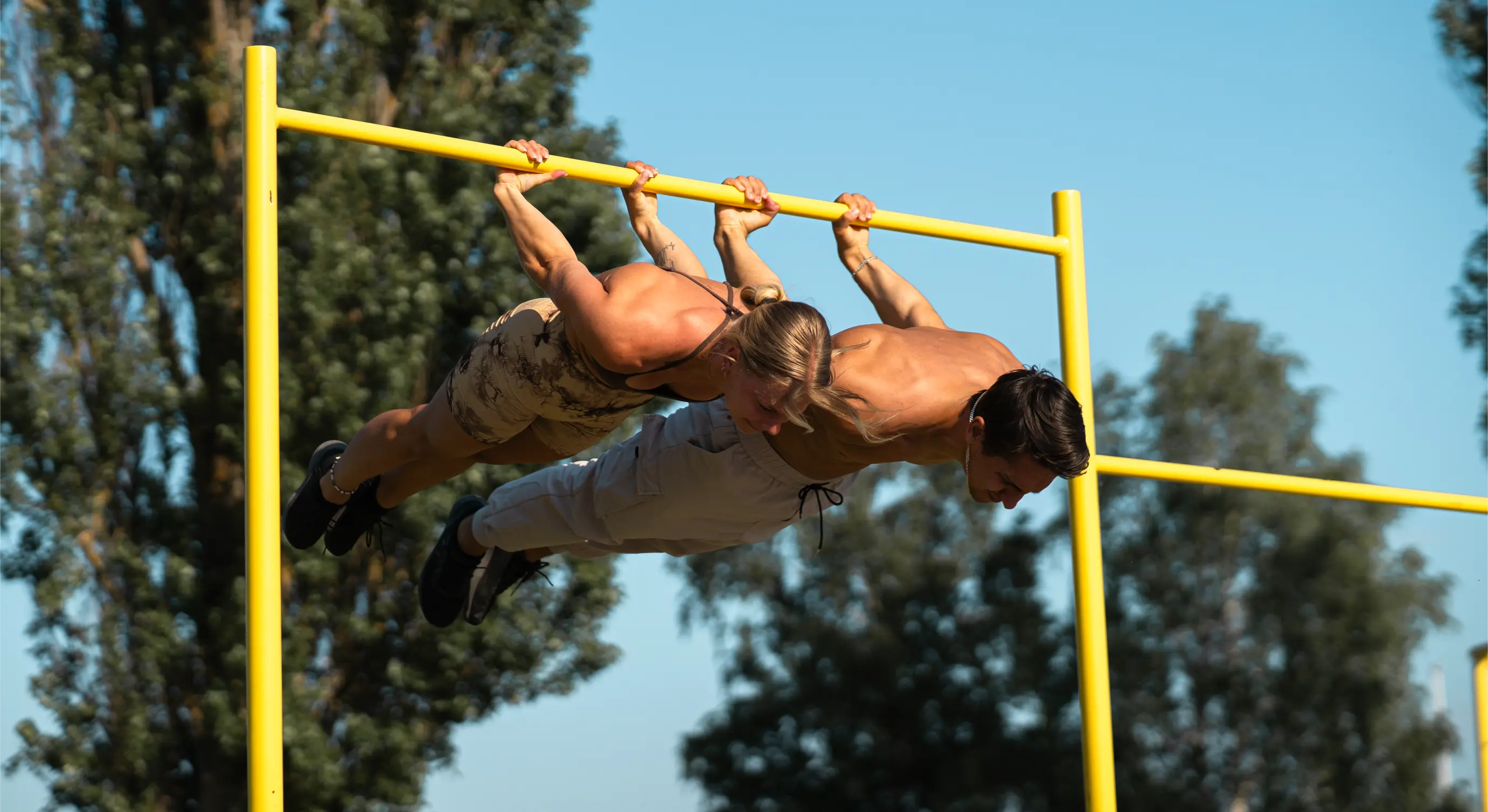 Daniel Flefil & Malin Malle doing a backlever in a calisthenics park