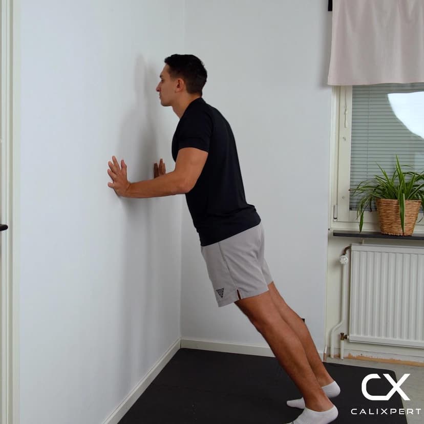 Scapula push-up mot vägg